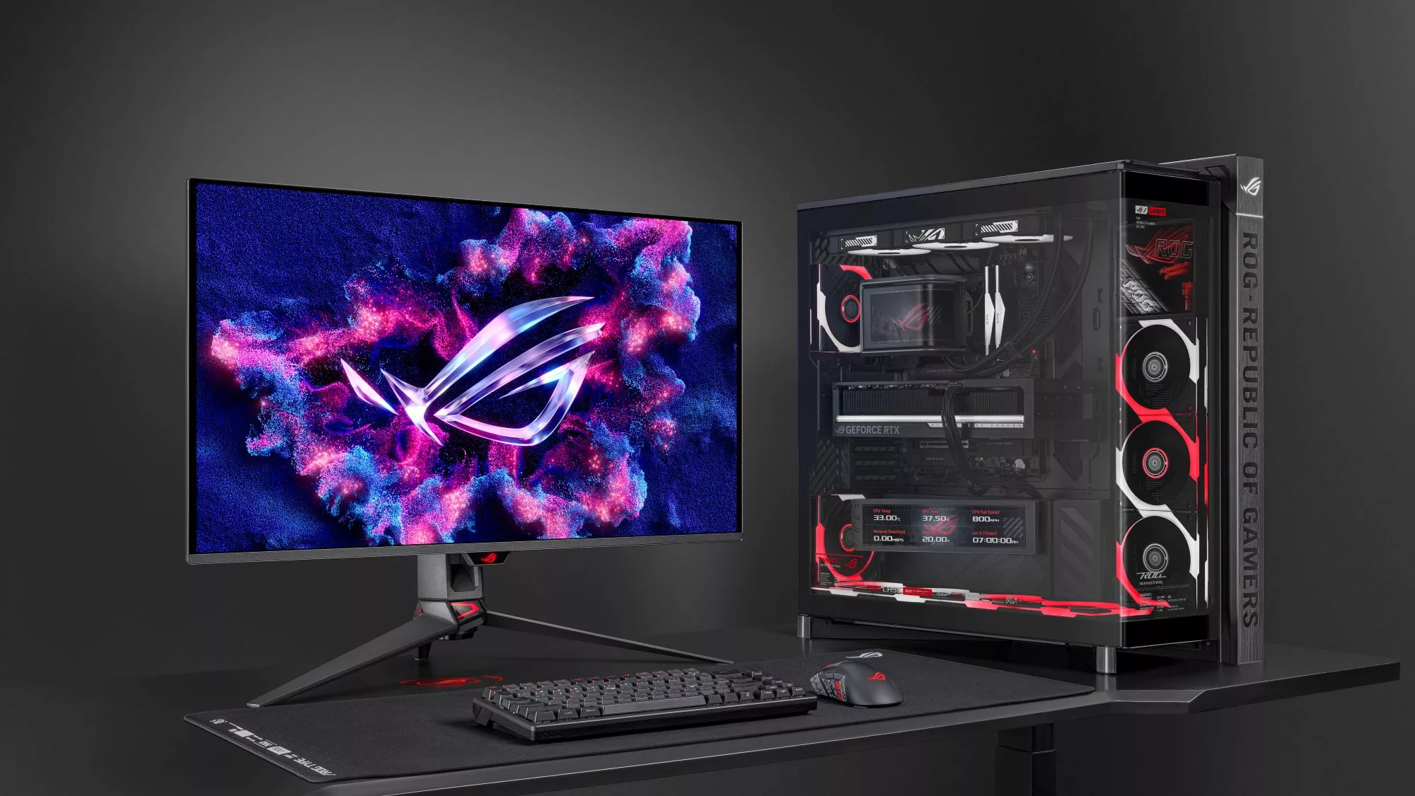ROG Cronox ARGB numa secretária ao lado de um monitor ROG